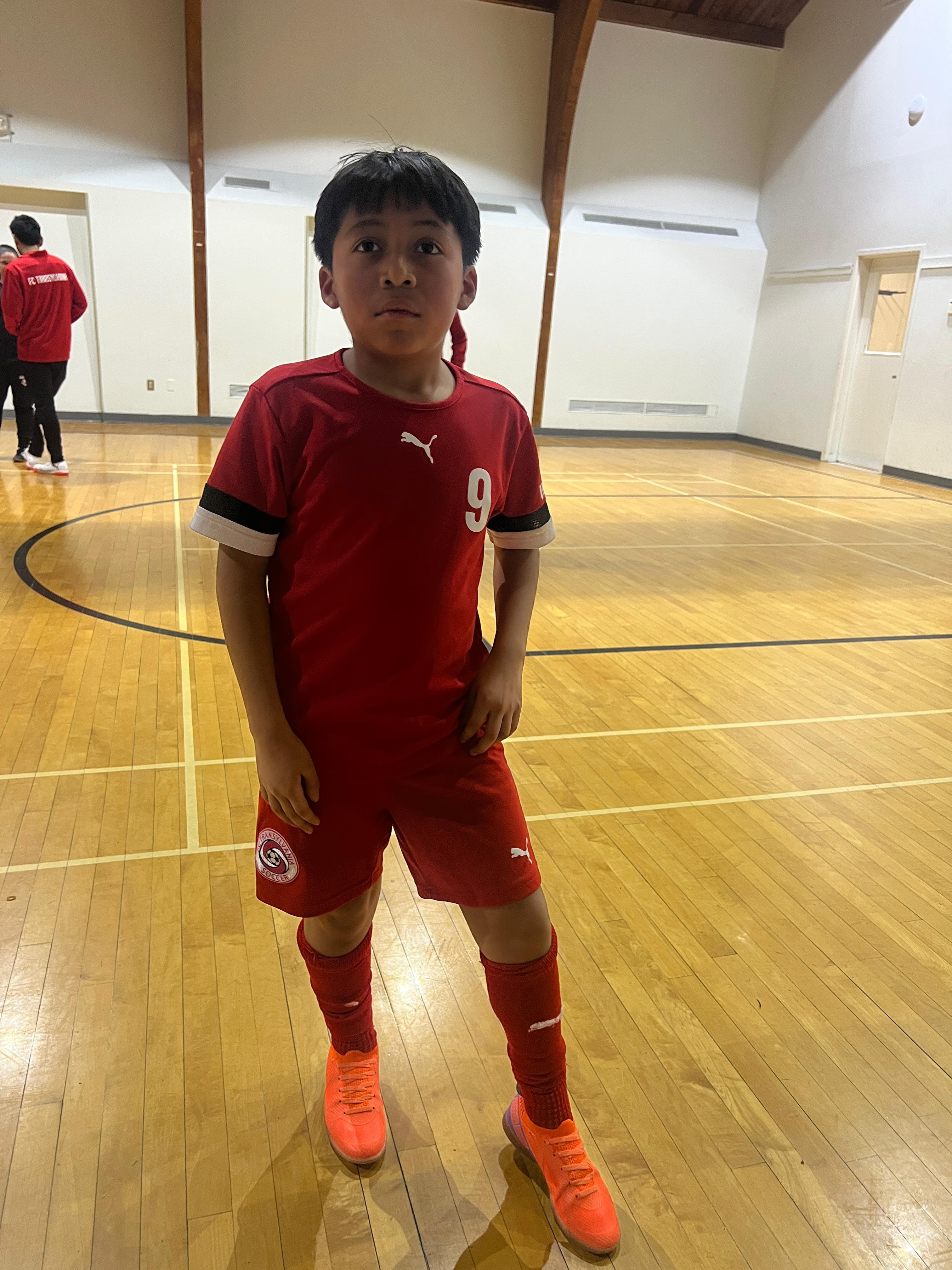 Young supporter Dylan at a Wave-A-Flag soccer session